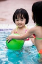 Asian Chinese Little Girls Playing in the Swimming Pool Royalty Free Stock Photo