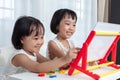 Asian Chinese little girls playing toys
