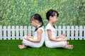 Asian Chinese little girls practicing yoga pose on a mat Royalty Free Stock Photo
