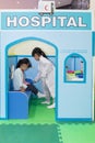 Asian Chinese little girls role-playing at hospital Royalty Free Stock Photo