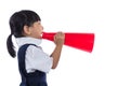 Asian Chinese little primary school girl holding retro megaphone Royalty Free Stock Photo