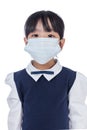 Asian Chinese little primary school girl wearing a protective ma Royalty Free Stock Photo