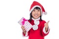 Asian Chinese little santa girl holding present with thumbs up Royalty Free Stock Photo