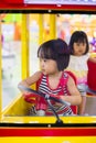 Asian Chinese Little Sister Driving Toy Bus Royalty Free Stock Photo