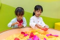 Asian Chinese Little Sister Playing Kinetic Sand