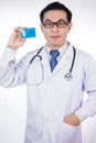 Asian Chinese male doctor holding credit card with stethoscope Royalty Free Stock Photo