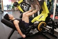 Asian chinese man in gym Ã¯Â¼ÅFitness sport man Training of leg strength in the gym Royalty Free Stock Photo