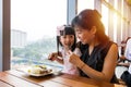 Asian Chinese mother and daughter eating steak
