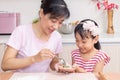 Asian Chinese mother and daughter making dumpling in the kitchen Royalty Free Stock Photo