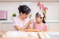 Asian Chinese mother and daughter making dumpling in the kitchen Royalty Free Stock Photo