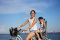 Asian Chinese Mother and daugther cycling outdoors with COVID mask Royalty Free Stock Photo