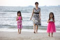 Asian Chinese mum and daughters playing sand together