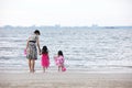 Asian Chinese mum and daughters playing sand together