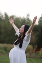 Asian Chinese pregnant woman embrace nature hug in forest outdoor have a deep breath try to relax in nature outdoor Royalty Free Stock Photo