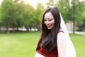 Asian pregnant woman hold Bouquet smell fragrance of flower  in garden forest lawn outdoor nature free relax happy sunshine Royalty Free Stock Photo