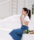 Asian Chinese university student drink milk on the playground Royalty Free Stock Photo