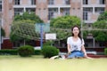 Asian Chinese university student play on the playground Royalty Free Stock Photo