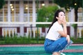 Asian Chinese university student play on the Tennis court playground Royalty Free Stock Photo