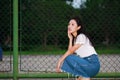 Asian Chinese university student play on the Tennis court playground Royalty Free Stock Photo