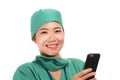 Asian Chinese woman as successful physician using hand phone - young beautiful and happy medicine doctor or chief hospital nurse Royalty Free Stock Photo
