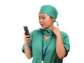 Asian Chinese woman as successful physician using hand phone - young beautiful and happy medicine doctor or chief hospital nurse Royalty Free Stock Photo