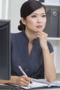 Asian Chinese Woman or Businesswoman in Office Royalty Free Stock Photo