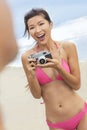 Asian Chinese Woman Girl Camera at Beach in Bikini Royalty Free Stock Photo