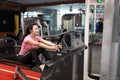 Asian chinese woman in gym Ã¯Â¼ÅFitness woman doing triceps exercises in the gym. Attractive, adult. Royalty Free Stock Photo