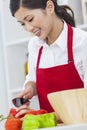 Asian Chinese Woman Preparing Vegetables Salad Food in Kitchen Royalty Free Stock Photo