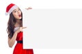 Asian Christmas girl with Santa Claus clothes holding blank sign Royalty Free Stock Photo