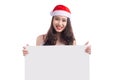 Asian Christmas girl with Santa Claus clothes holding blank sign Royalty Free Stock Photo