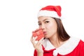 Asian Christmas girl with Santa Claus clothes and red gift box Royalty Free Stock Photo