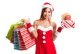Asian Christmas girl with Santa clothes, gift box and shopping Royalty Free Stock Photo