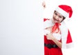 Asian Christmas Santa Claus girl thumbs up with blank sign. Royalty Free Stock Photo