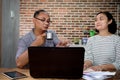 Asian Co-Workers Having Relaxed Business Conversation in The Kitchen at Home Office Royalty Free Stock Photo