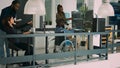 Asian coder with physical disability working with african american developer Royalty Free Stock Photo