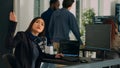 Asian coder turning head to work with holographic server code Royalty Free Stock Photo