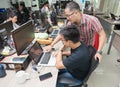 Asian Colleagues Software Developers Team Sitting At Desk Royalty Free Stock Photo