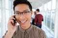 Asian college boy talking on the phone Royalty Free Stock Photo