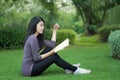 Asian college student on campus in park Royalty Free Stock Photo