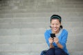 Asian college student using smartphone Royalty Free Stock Photo