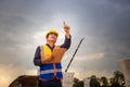 Asian construction engineer checking project at the building site, Foreman worker in hardhat at the infrastructure construction Royalty Free Stock Photo