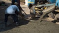 Construction workers group with cement mixer truck are pouring concrete on the floor in construction site Royalty Free Stock Photo