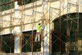 Asian contruction worker on scaffold