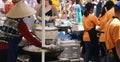 Asian cooks serving food Royalty Free Stock Photo