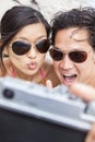 Asian Couple at Beach Taking Selfie Photograph Royalty Free Stock Photo