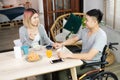 Asian couple breakfast at home.wife holding hand and encourage d