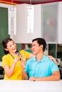 Asian couple drinking white wine at home Royalty Free Stock Photo