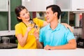 Asian couple drinking white wine at home Royalty Free Stock Photo