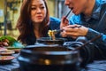 Asian couple are eating at chinese cafe